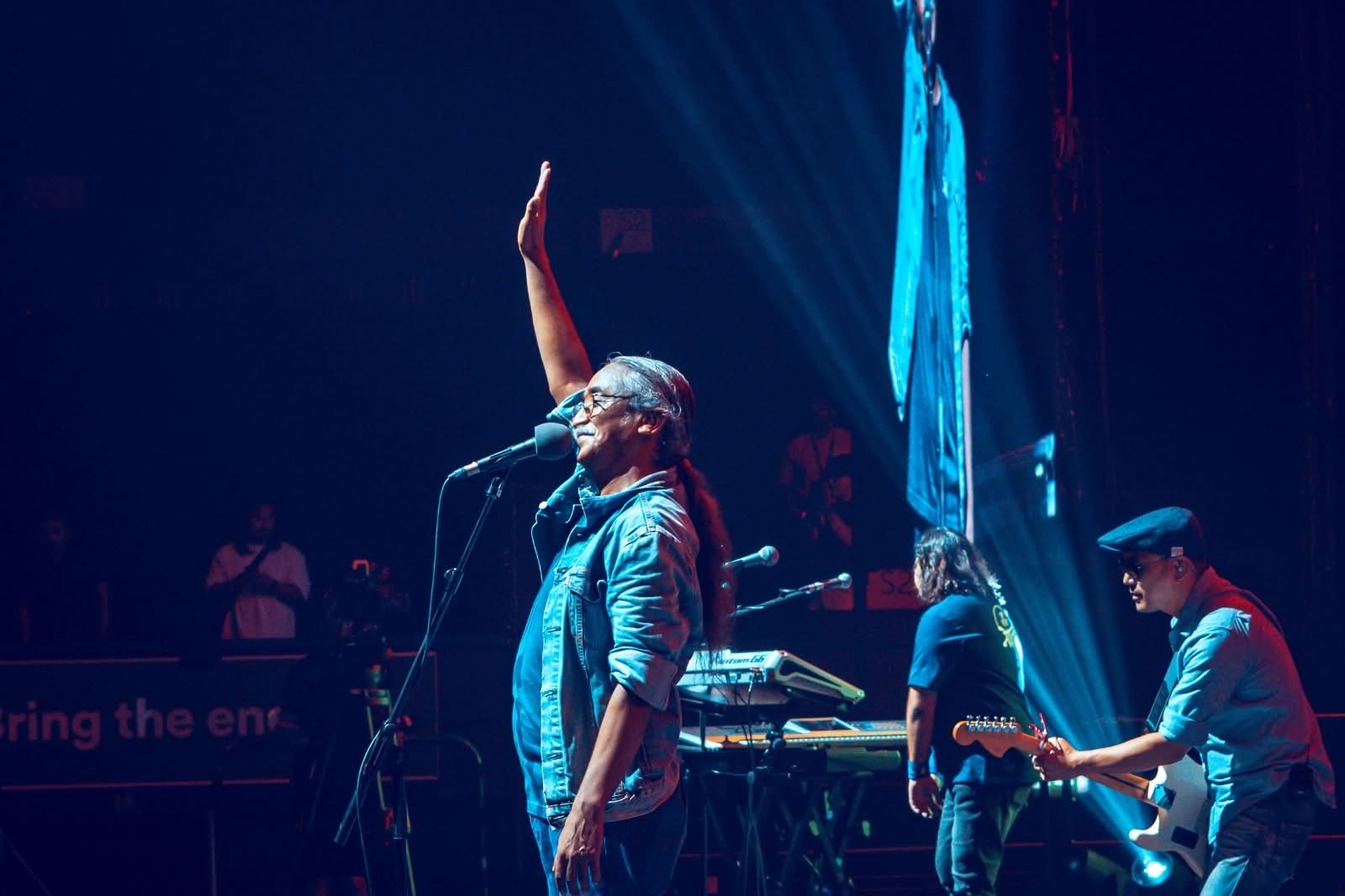 Vocalist saluting the crowd mid-song
